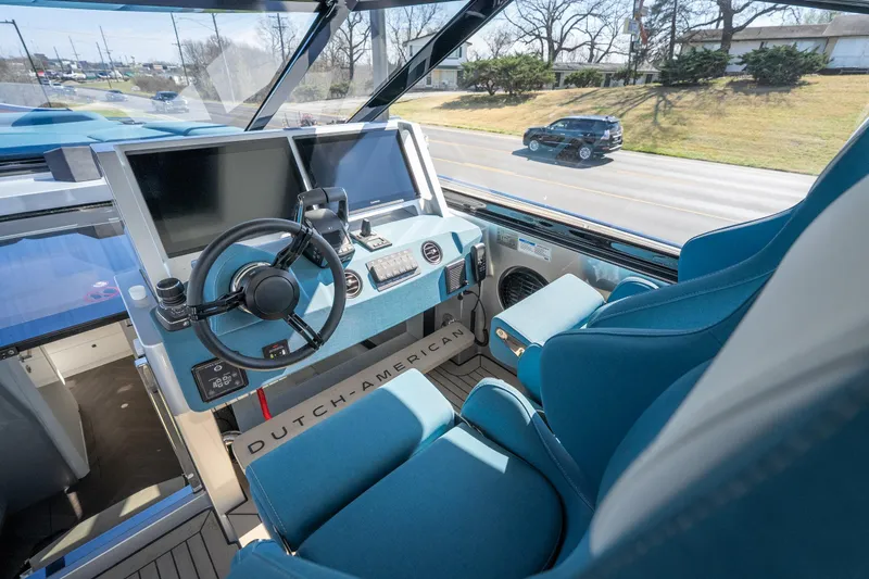 Slide: The Image of Interior of 2026 Dutch American DA 53 boat with modern steering and controls. - 26