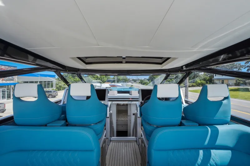 Slide: The Image of Interior view of 2026 Dutch American DA 53 boat with blue seating and modern design. - 33