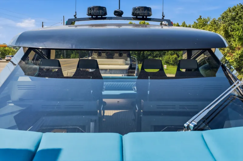 Slide: The Image of Front view of a 2026 Dutch American DA 53 boat with modern design and seating. - 58