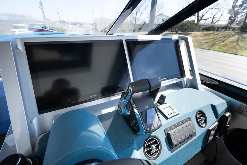 Slide: The Image of Modern cockpit of 2026 Dutch American DA 53 boat with dual Garmin displays. - 28