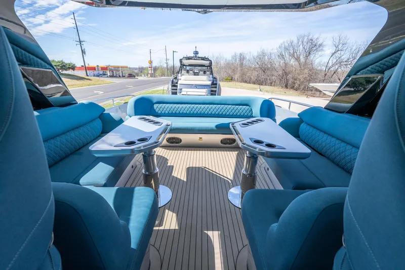 Slide: The Image of Luxurious interior of 2026 Dutch American DA 53 boat with blue seating and tables. - 29