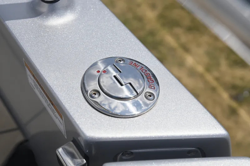 Slide: The Image of Close-up of a Dutch American DA 53 gasoline cap, 2026 model, on a metallic surface. - 77