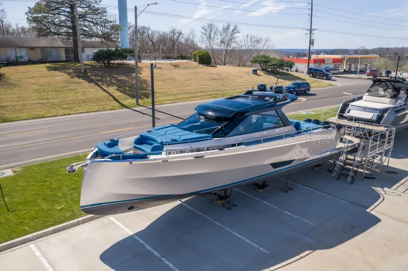 Slide: The Image of Modern 2026 Dutch American DA 53 yacht displayed on a trailer in a parking lot. - 3