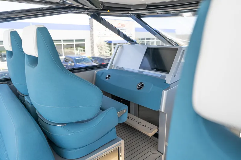 Slide: The Image of Interior of 2026 Dutch American DA 53 boat with blue seating and modern dashboard. - 31