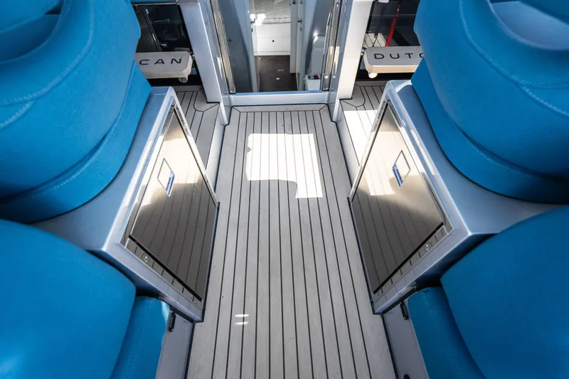 Slide: The Image of Interior of 2026 Dutch American DA 53 yacht with blue seating and sleek flooring. - 33