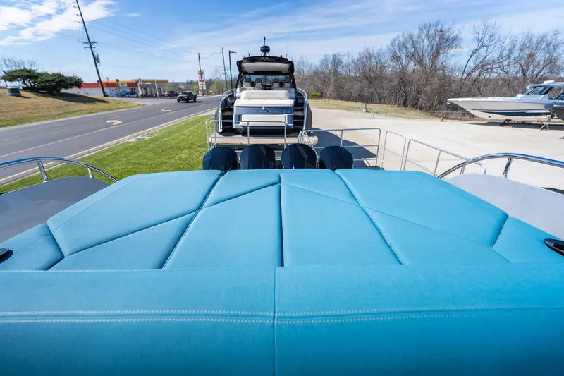 Slide: The Image of 2026 Dutch American DA 53 boat with blue upholstery, parked near a road. - 35