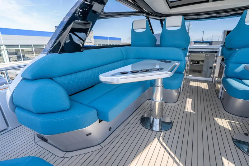 Slide: The Image of Luxurious interior of 2026 Dutch American DA 53 yacht with blue seating and sleek table design. - 37