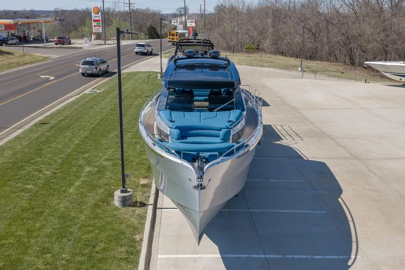 Slide: The Image of Luxurious 2026 Dutch American DA 53 yacht parked near a road and gas station. - 4