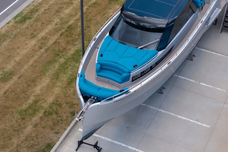 Slide: The Image of Aerial view of 2026 Dutch American DA 53 yacht with blue seating on display. - 3