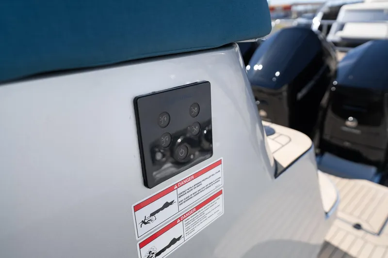 Slide: The Image of Control panel on a 2026 Dutch American DA 53 boat with warning labels. - 41