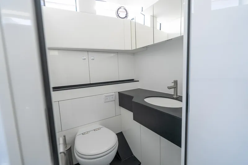 Slide: The Image of Modern yacht bathroom with sleek design, featuring a toilet and stylish sink. Dutch American DA 53, 2026. - 43