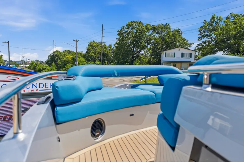 Slide: The Image of 2026 Dutch American DA 53 boat with blue seating, docked outdoors on a sunny day. - 20