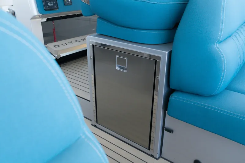 Slide: The Image of Interior of 2026 Dutch American DA 53 boat with blue seating and stainless steel compartment. - 61