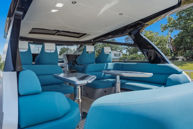 Slide: The Image of Luxurious interior of 2026 Dutch American DA 53 yacht with blue seating and sleek design. - 10