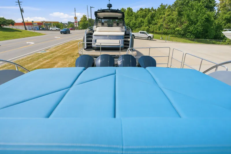 Slide: The Image of Luxury Dutch American DA 53 boat with blue seating, parked near a road, 2026 model. - 74