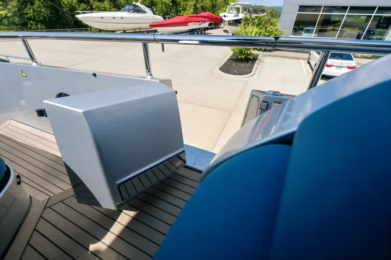 Slide: The Image of Deck view of 2026 Dutch American DA 53 yacht at marina with boats in background. - 72