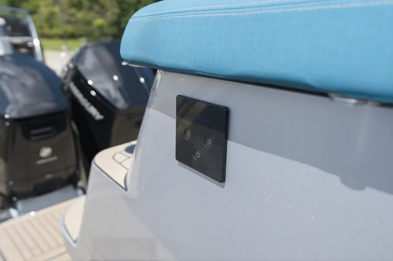 Slide: The Image of Close-up of a 2026 Dutch American DA 53 boat with blue upholstery and control panel. - 18