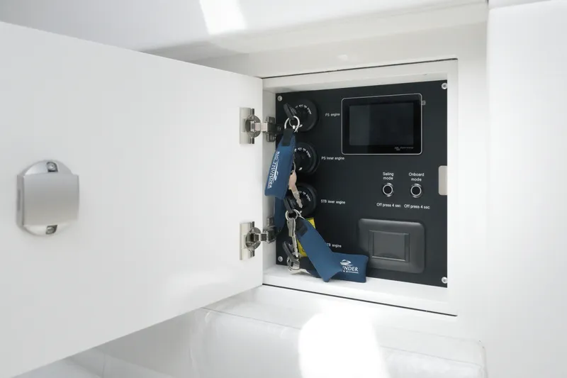 Slide: The Image of Control panel inside a Dutch American DA 53, 2026 model, with keys and switches. - 51