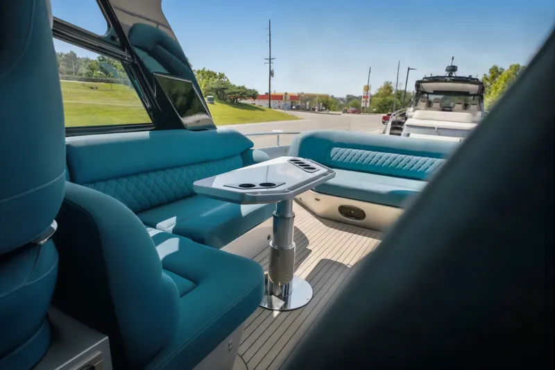 Slide: The Image of Luxurious interior of 2026 Dutch American DA 53 boat with blue seating and sleek table. - 19