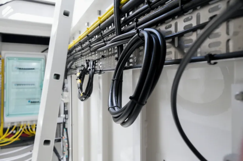 Slide: The Image of Interior view of Dutch American DA 53, 2026 model, showcasing organized wiring and cables. - 69