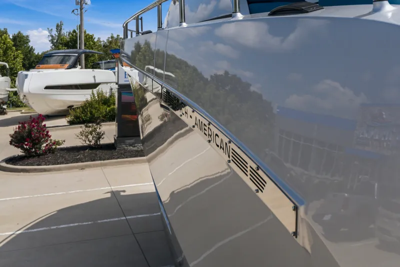Slide: The Image of 2026 Dutch American DA 53 boat reflecting surroundings in a sunny outdoor setting. - 16