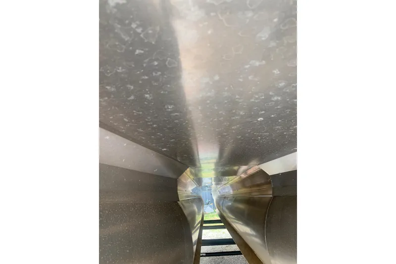 Slide: The Image of Underneath view of 2022 Barletta C22UC pontoon boat, showcasing structural details. - 14