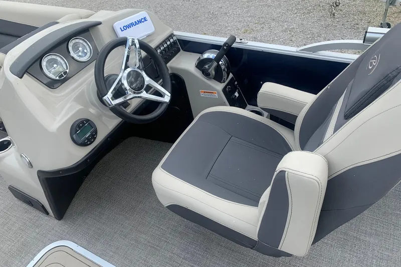 Slide: The Image of 2022 Barletta C22UC boat cockpit with steering wheel and control panel. - 4