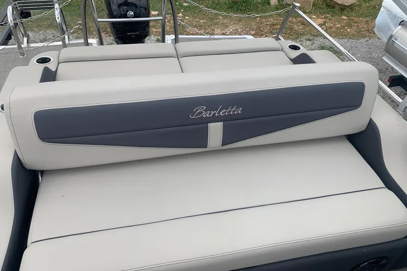 Slide: The Image of 2022 Barletta C22UC boat seating with elegant gray upholstery and branding. - 6