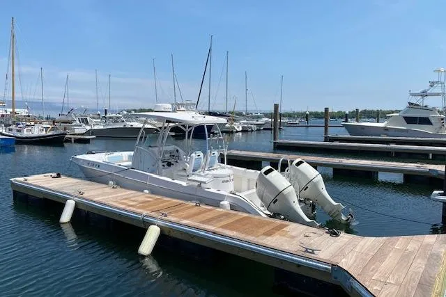 The Image of 2020 Twin Vee 260 CC SE boat docked at a marina with clear skies. - 0