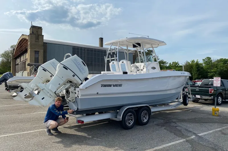 Slide: The Image of 2020 Twin Vee 260 CC SE boat on trailer in parking lot. - 2