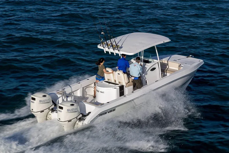 Slide: The Image of Manufacturer Provided Image: 2020 Twin Vee 260 CC SE boat cruising on the ocean with three passengers. - 5