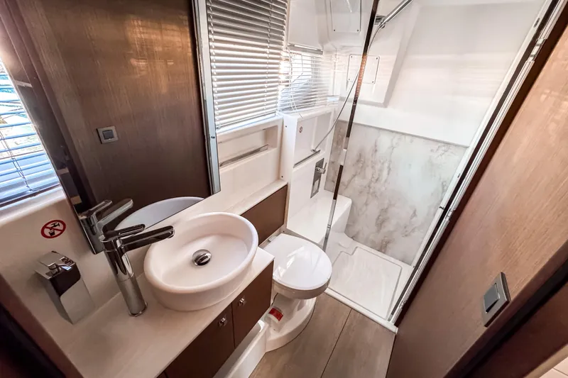 Slide: The Image of Modern bathroom interior of 2026 Wellcraft 44 Explorer yacht, featuring sleek fixtures and shower. - 43