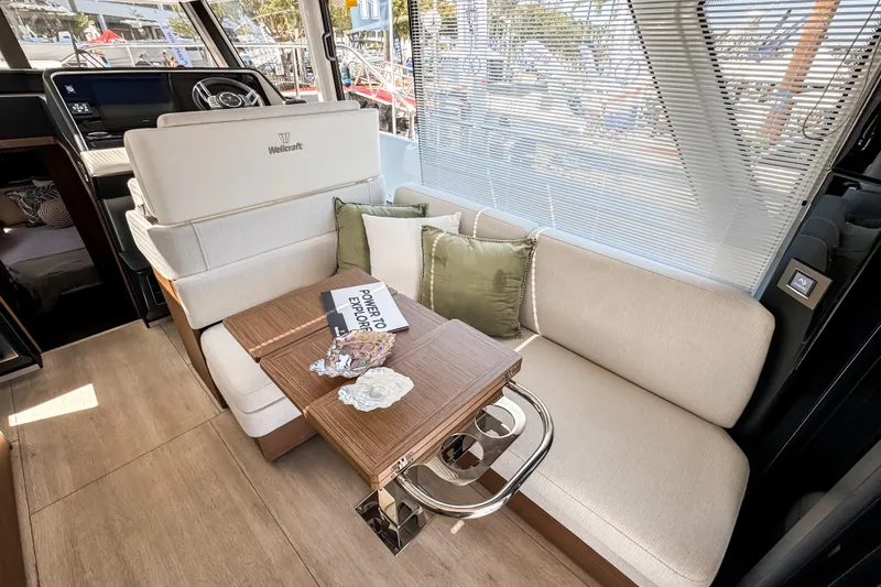 Slide: The Image of Interior of 2026 Wellcraft 44 Explorer yacht with elegant seating and wooden table. - 13