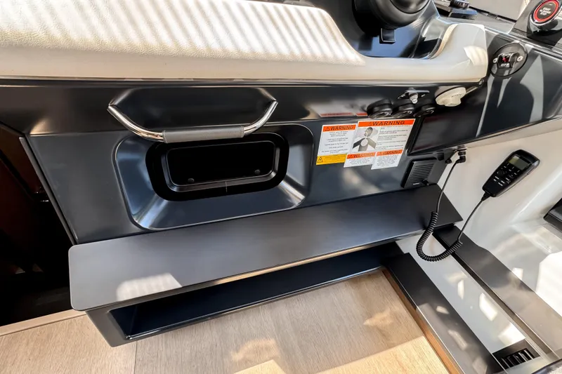 Slide: The Image of 2026 Wellcraft 44 Explorer dashboard with controls and warning labels. - 25