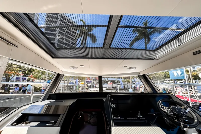 Slide: The Image of Interior view of 2026 Wellcraft 44 Explorer yacht with panoramic sunroof and modern helm. - 30