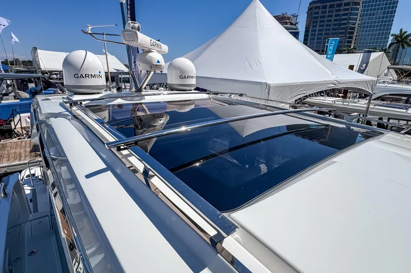 Slide: The Image of 2026 Wellcraft 44 Explorer yacht with Garmin equipment at a boat show. - 48