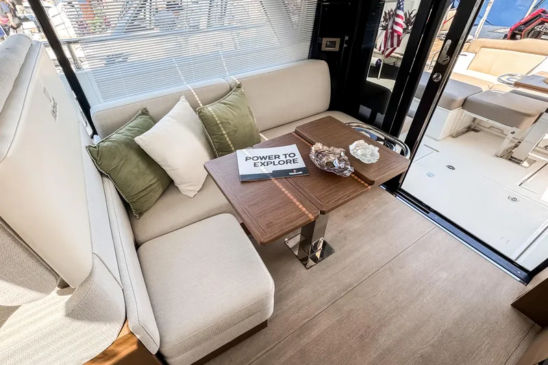 Slide: The Image of Luxurious interior of 2026 Wellcraft 44 Explorer yacht with elegant seating and table. - 14