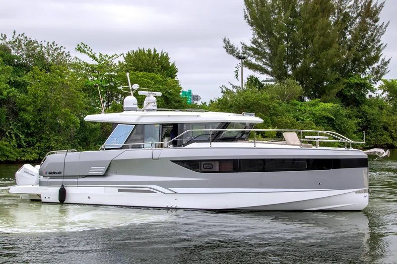 Slide: The Image of 2026 Wellcraft 44 Explorer Yacht on calm waters. - 2