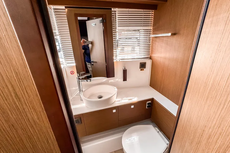 Slide: The Image of Modern bathroom interior of 2026 Wellcraft 44 Explorer yacht with sleek design and wooden finishes. - 37