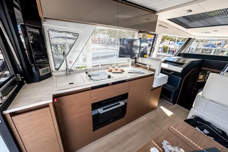 Slide: The Image of Luxurious interior of 2026 Wellcraft 44 Explorer yacht featuring modern kitchen and seating area. - 15