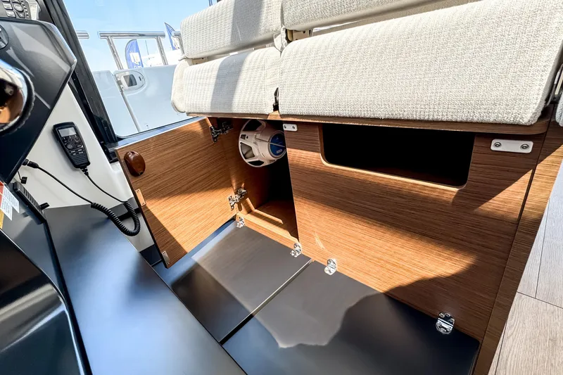 Slide: The Image of Interior of 2026 Wellcraft 44 Explorer boat with wood paneling and seating. - 24