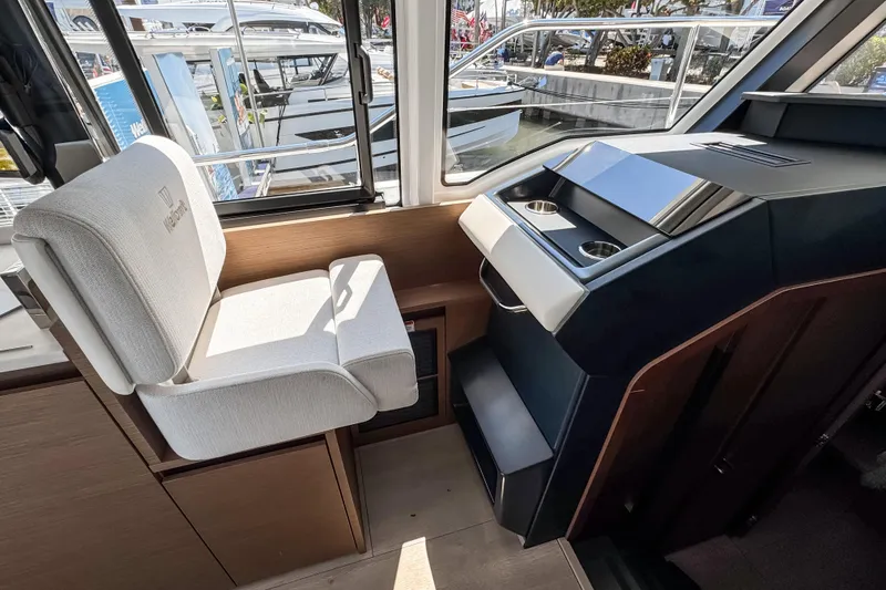 Slide: The Image of Interior of 2026 Wellcraft 44 Explorer yacht, featuring helm seat and control panel. - 29