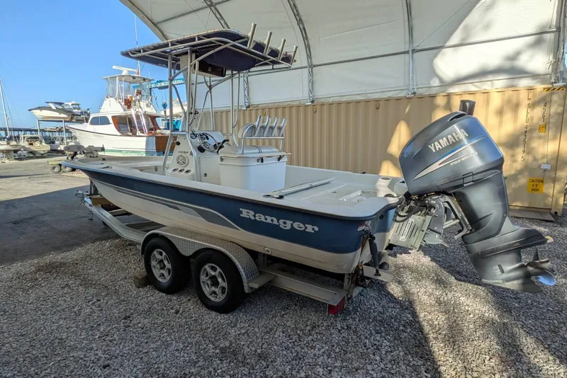 The Image of 2005 Ranger 2180 Bay Ranger boat with Yamaha outboard motor on trailer. - 1