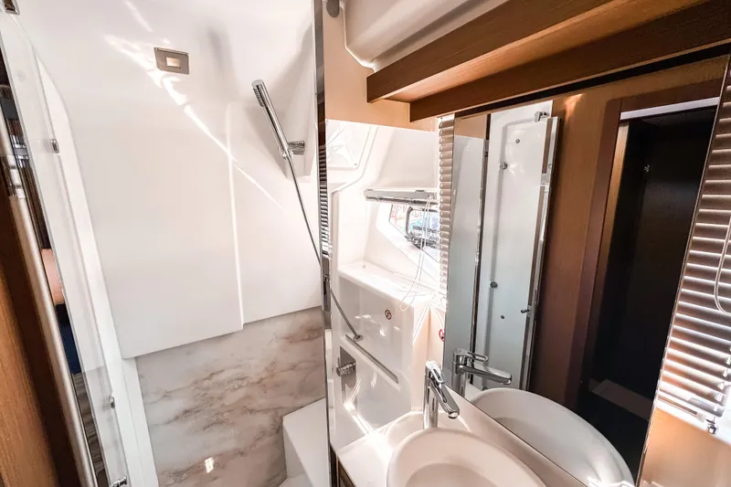 Slide: The Image of Luxurious bathroom interior of 2026 Wellcraft 44 Explorer yacht, featuring modern fixtures and elegant design. - 38