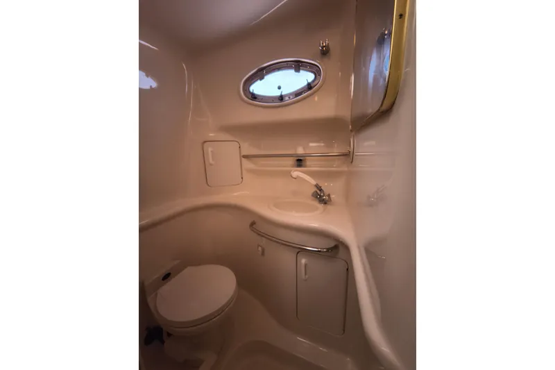 Slide: The Image of Bathroom interior of 1998 Sea Ray Sundancer 330 yacht, featuring sink and toilet. - 10