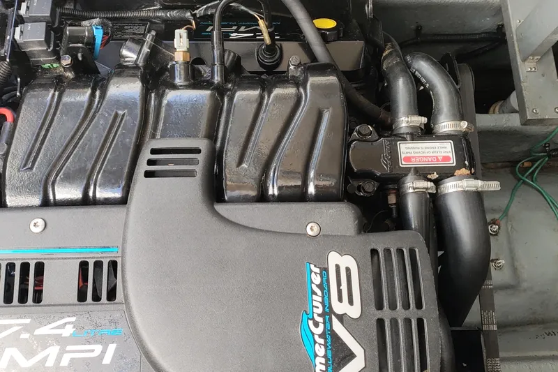 Slide: The Image of 1998 Sea Ray Sundancer 330 engine compartment with MerCruiser V8 engine components. - 6