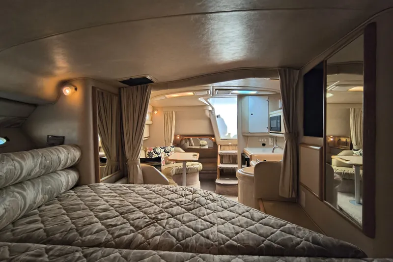 Slide: The Image of Interior of 1998 Sea Ray Sundancer 330 yacht, featuring cozy cabin and modern amenities. - 8