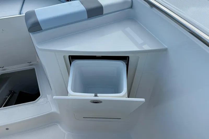 Slide: The Image of 2025 Robalo R360 Center Console boat with built-in storage compartment. - 27