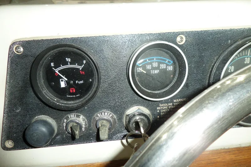 Slide: The Image of 1980 Lyman-Morse Fisherman Sleeper dashboard with fuel and temperature gauges. - 21