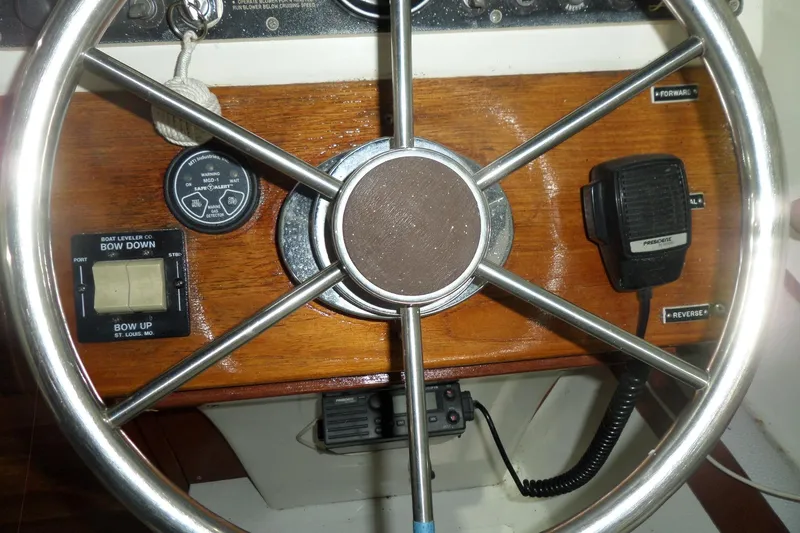 Slide: The Image of Steering wheel of a 1980 Lyman-Morse Fisherman Sleeper boat with control panel. - 24